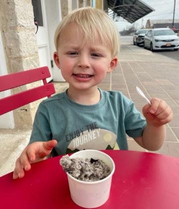 Two-year-old Briggs Perryman knows the best way to beat the summertime heat is with a big scoop of ice cream. Daytime highs remain around the century mark, with no rain predictions in sight. JOYCESARAH MCCABE | DISPATCH RECORD