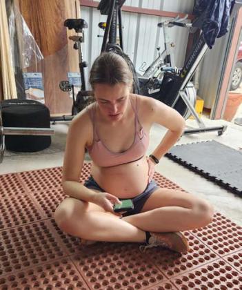 Columnist Alexandria Randolph rests post workout and logs her activity on a tracker app during her sixth month of pregnancy. Mothers who exercise during pregnancy have lower risk of pregnancy and labor complications. Alexandria Randolph | Lampasas Dispatch Record